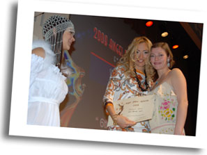 Elika Portnoy convincing portrayal as Dessi fishmonger waitress transforming into a model receiving best female actor award..in light romantic comedy 'Tricks of a Woman'